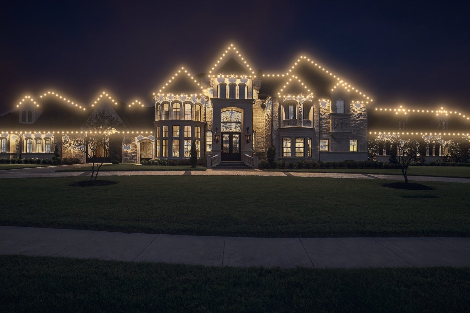 large estate home after lighting