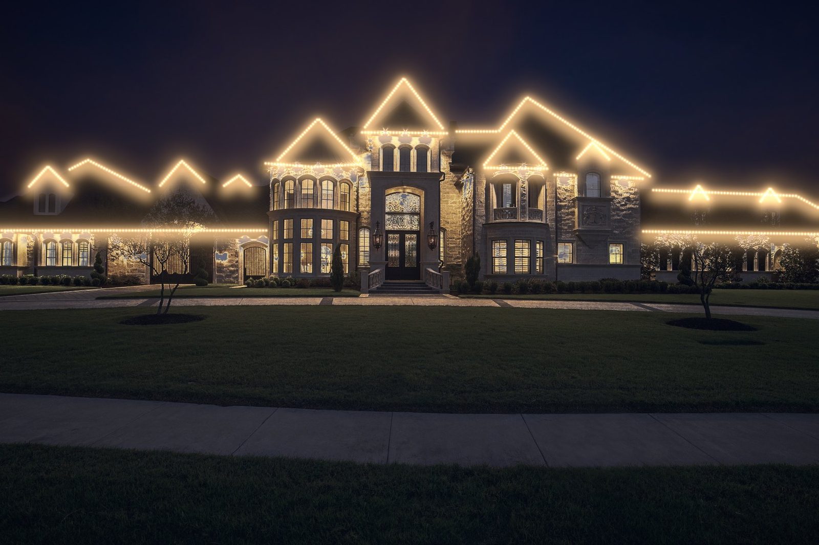 large estate home after lighting