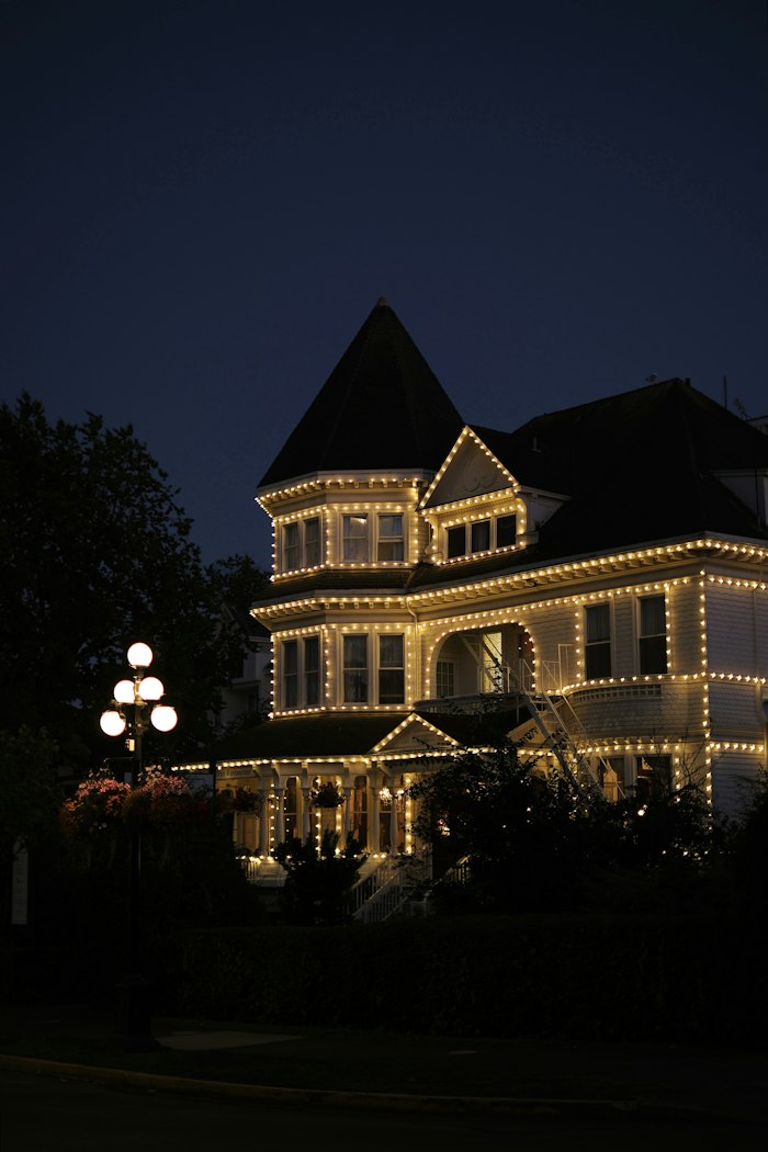 House adorned with lights at dusk