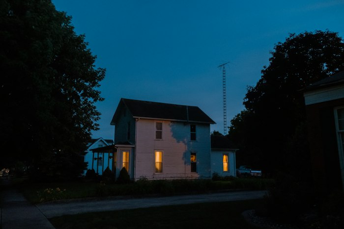 House lit up at night with exterior accent lighting